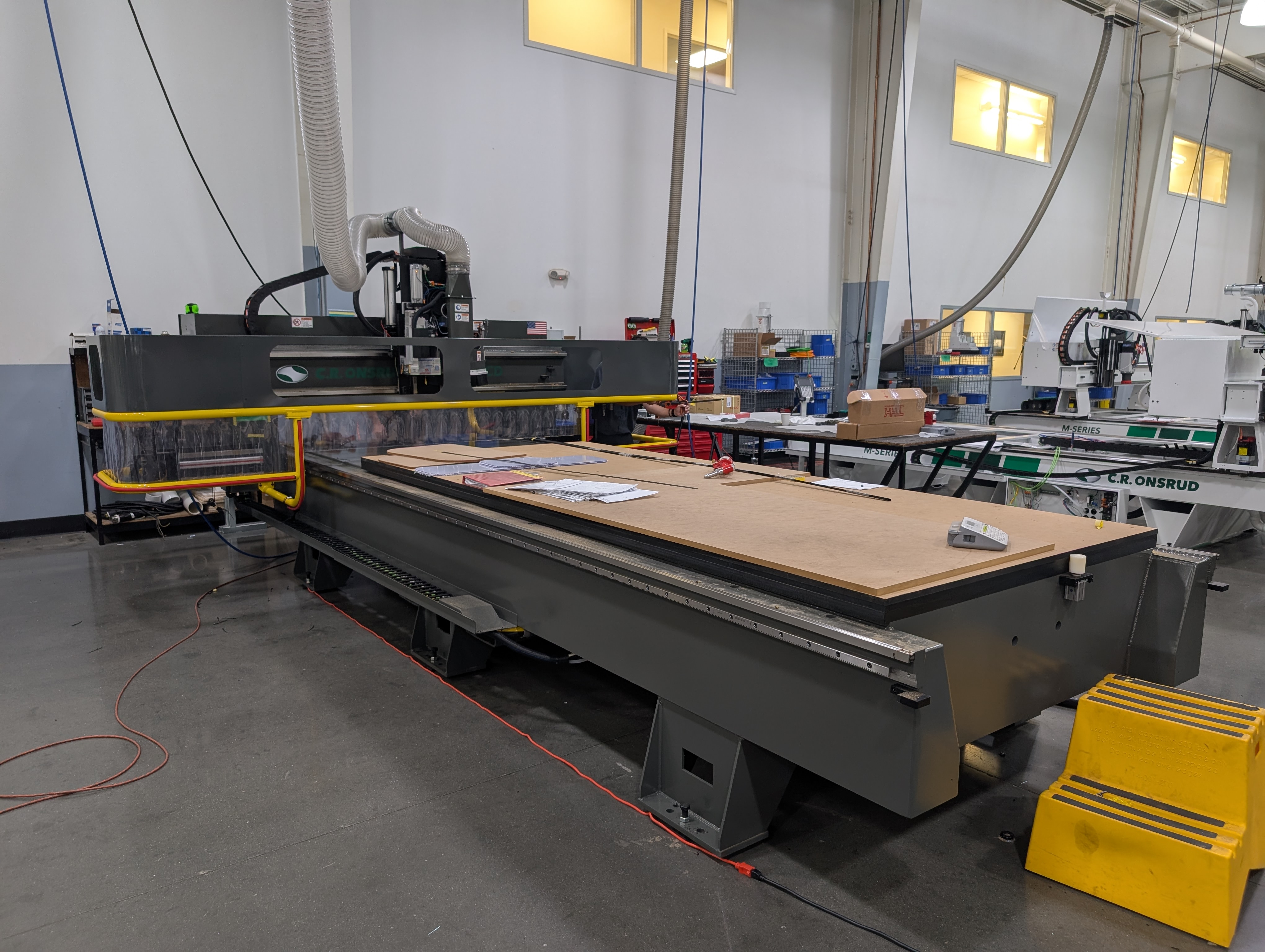 Professional CNC cabinet cutting machine processing plywood sheets at Peppermodern Mooresville NC workshop
